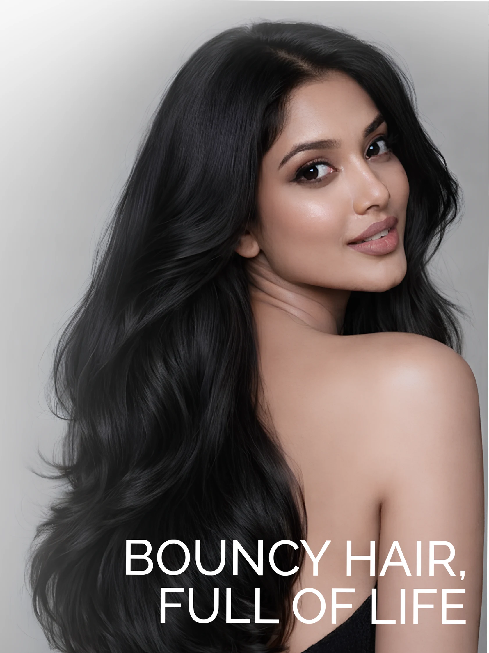 Woman with long, bouncy, healthy hair showcasing smooth shine after using aloe conditioner